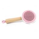 Imagen que muestra el producto Cepillo Bambú Para Mascotas. Cepillo de cabeza redonda con cerdas de metal, mango antideslizante y botón en la parte trasera para expulsar el pelo. Material: Metal, madera                                                                                                                       Color: Rosado, verde, amarillo.                                                                                                       Disponible: Razas pequeñas y medianas con pelaje largo.