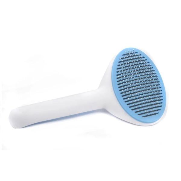 Imagen que muestra el producto Cepillo Cabezal Ovalado Para Mascotas. Cepillo con cerdas de metal, mango antideslizante y botón trasero para expulsar el pelo.  Material: Metal, plástico                                                                                                 Color: Gris, azul, rosado                                                                                                          Disponible: Razas pequeñas y medianas con pelaje largo.