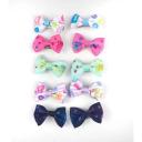 Imagen que muestra el producto Clip De Moño Pinzas Para Mascotas. Set de moños en pinza para mascotas. Material: Poliéster, metal Color: Disponible en la foto Disponible: Razas pequeñas y medianas.