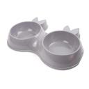 Imagen que muestra el producto Comedero Mascotas Con Bowl Removible. Comedero doble para mascotas, cuenta con bowl removibles. Material: Plástico Color: Gris, rosado Disponible: Razas pequeñas.