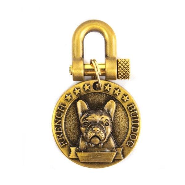 Imagen que muestra el producto Placa De Identificación Para Bulldog Frances. Placa de identificación con estampado de Samoyedo. Material: Metal                                                                        Color: Dorado                                                                                                         Disponible: Samoyedo